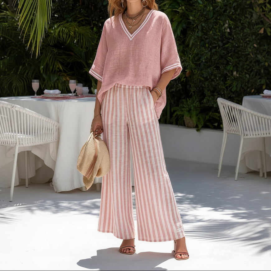 Front view of a woman wearing the Hadley striped linen set in a light color, standing casually outdoors.