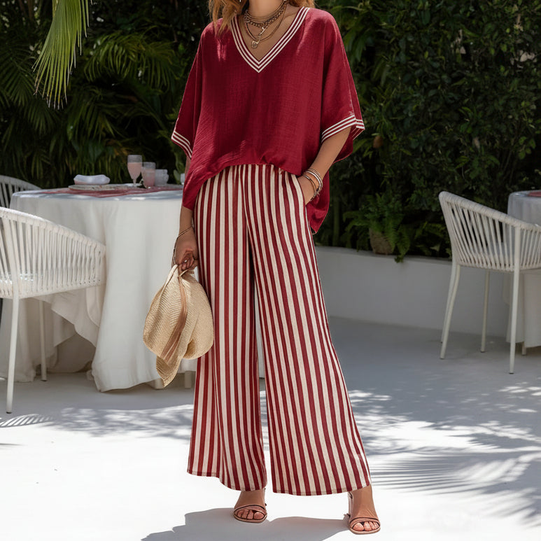 Side profile of a woman enjoying a sunny day, showcasing the relaxed fit of the Hadley striped linen set.