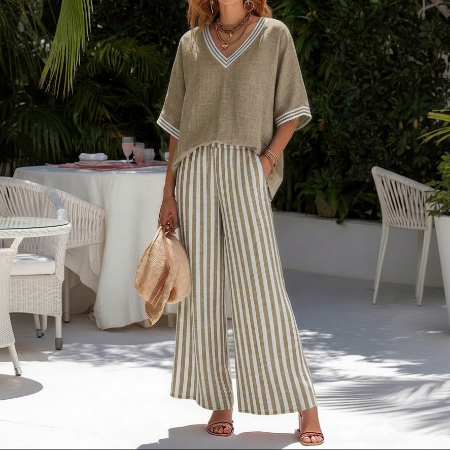 Lifestyle shot of the Hadley striped linen set paired with sandals and a straw bag, ready for a day trip.