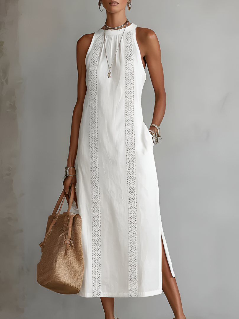Front view of a woman wearing a white Marlowe linen midi dress, showcasing its flowy silhouette and Mao collar.