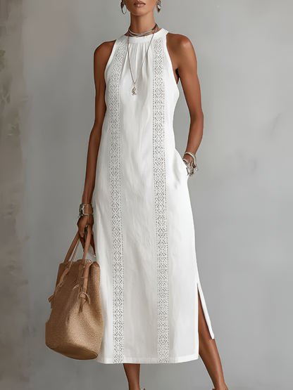 Front view of a woman wearing a white Marlowe linen midi dress, showcasing its flowy silhouette and Mao collar.