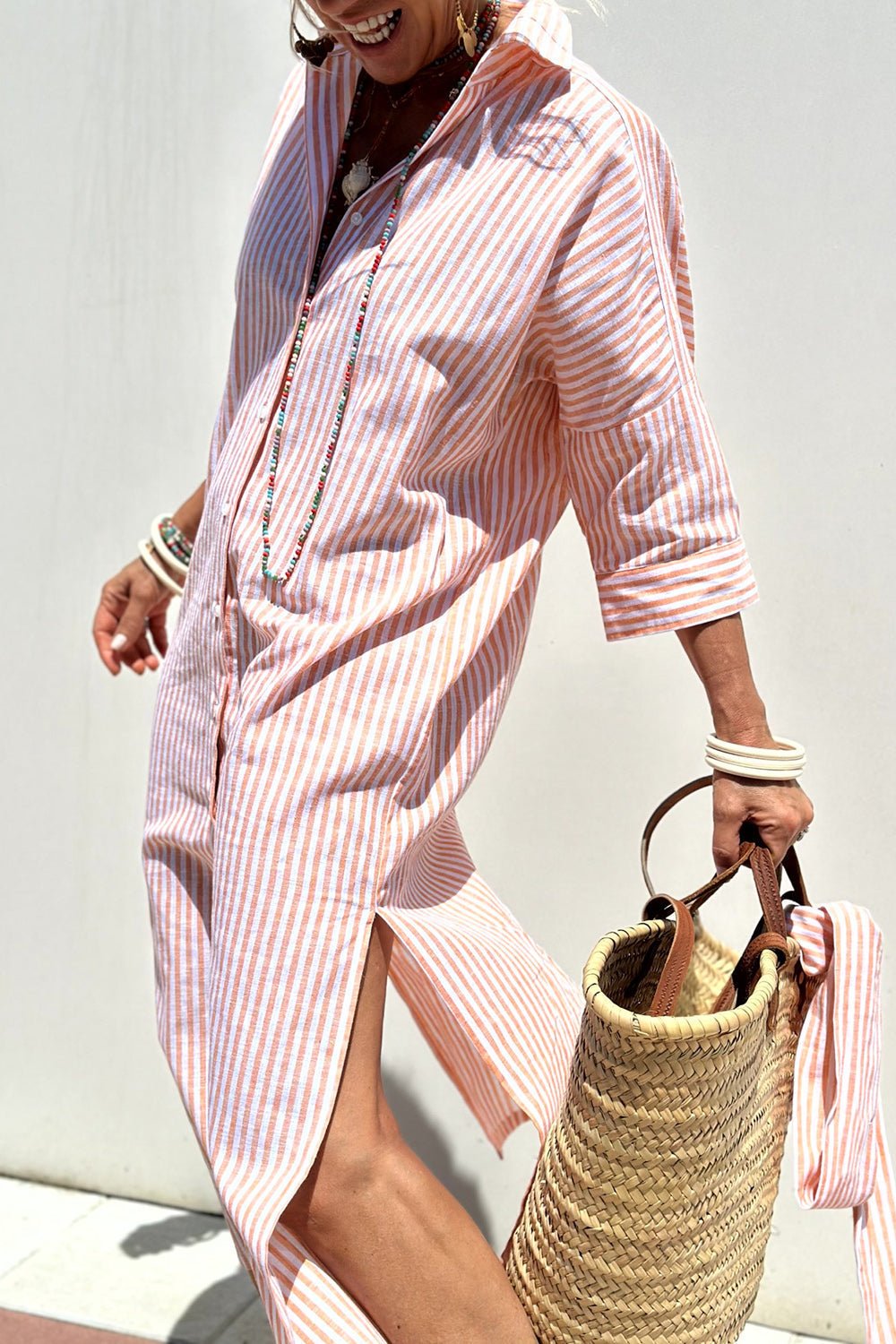 Close-up detail of the breathable striped fabric on the Paloma summer dress, showing texture and pattern.