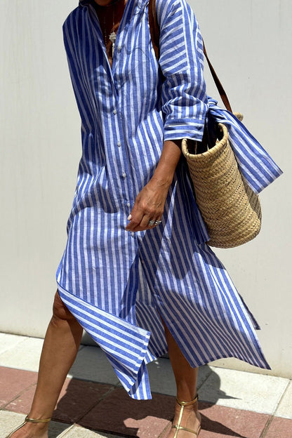 Model wearing the purple Paloma striped shirt dress, styled casually with sleeves rolled up for a playful look.