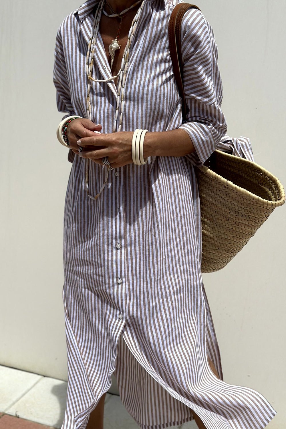 Detail shot of the button-down front and collar on the versatile Paloma striped shirt dress.
