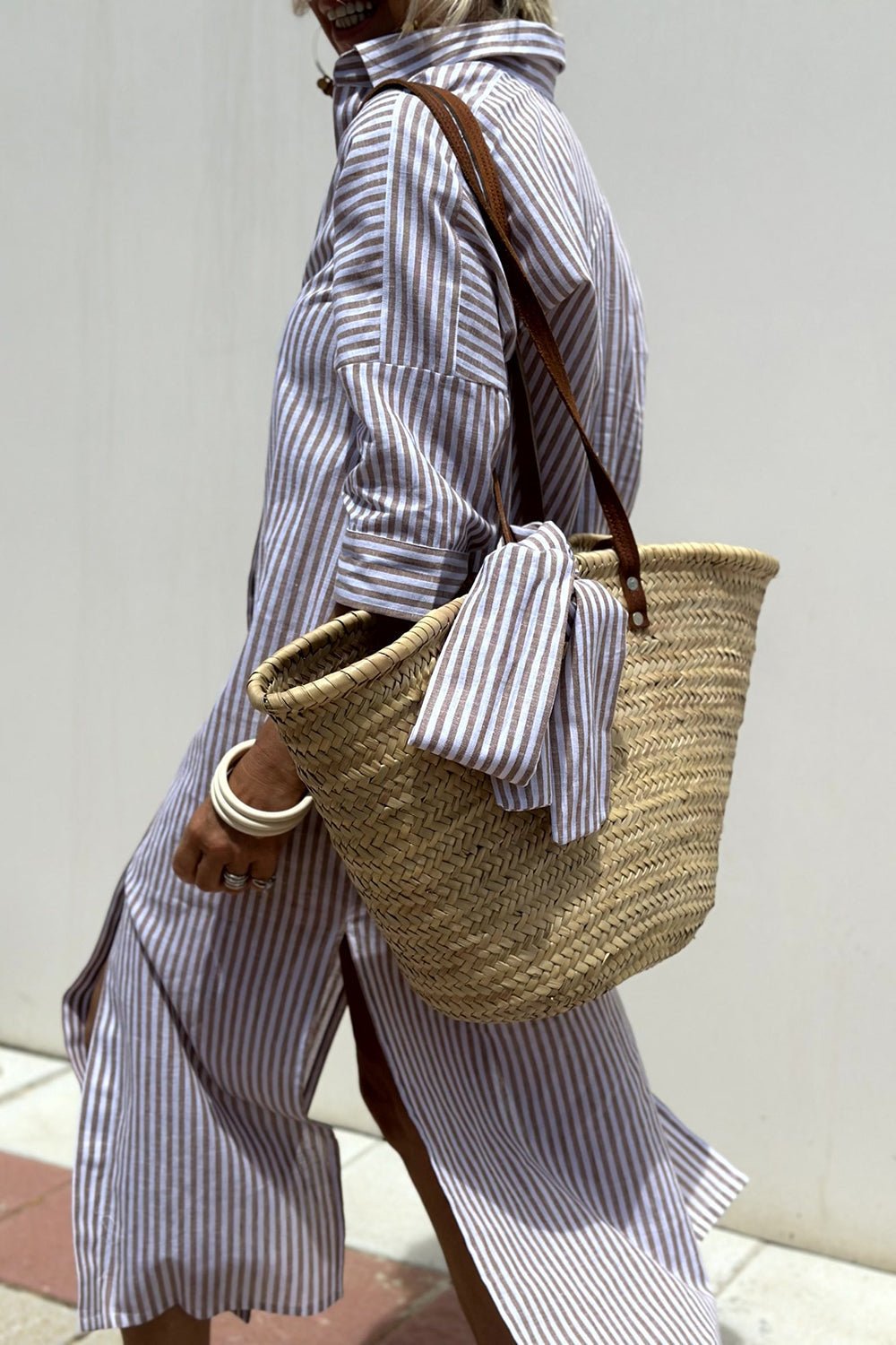 Full-length view of the Paloma striped shirt dress, capturing its effortless charm and suitability for warm weather.