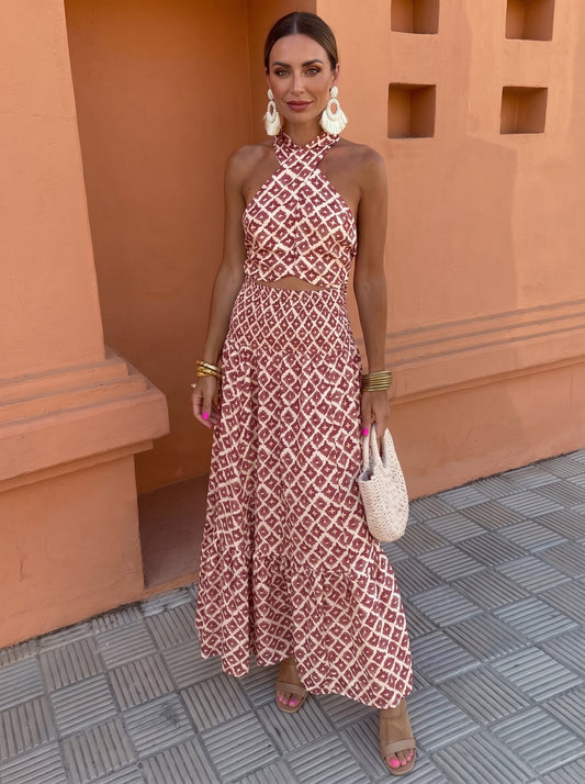 Front view of a woman wearing the blush pink elegant off-shoulder set, standing gracefully with a soft smile.