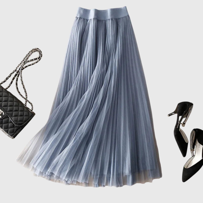 Front view of the Seraphina flowy pleated midi skirt in a vibrant blue, showcasing its elegant drape and delicate pleats.