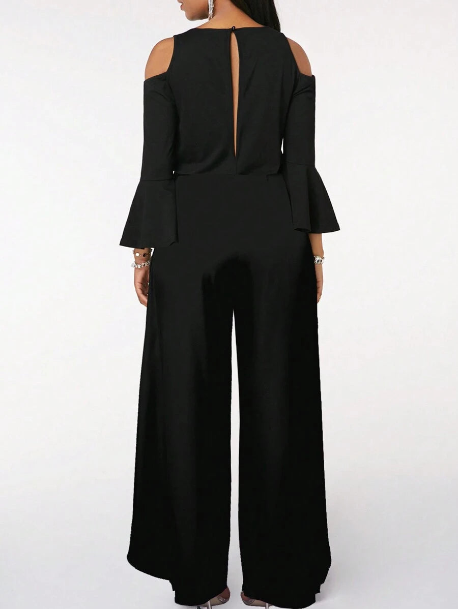 Lifestyle image of a woman walking outdoors, embodying the comfortable and versatile style of the Zarae elegant jumpsuit in a natural setting.