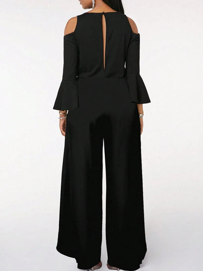 Lifestyle image of a woman walking outdoors, embodying the comfortable and versatile style of the Zarae elegant jumpsuit in a natural setting.