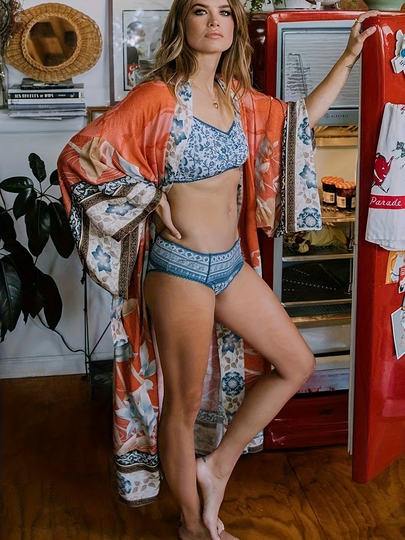 Back view of the Seraphina kimono highlighting its maxi length and flowing silhouette against a beach backdrop.