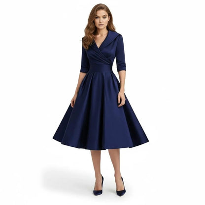 Front view of the Seraphina wrap midi dress in a vibrant magenta, showcasing its V-neckline and full skirt.