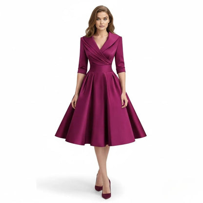 Close-up of the hemline of the Seraphina wrap midi dress, showing it falls just below the knee.