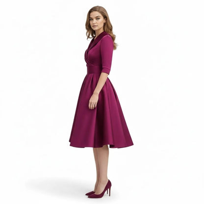 Fashion flat lay of the navy blue Seraphina dress, displaying its full shape and design features.