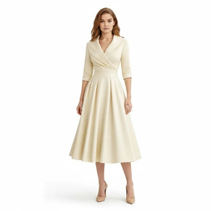Detail of the pleats on the A-line skirt of the Seraphina wrap midi dress, adding volume and movement.