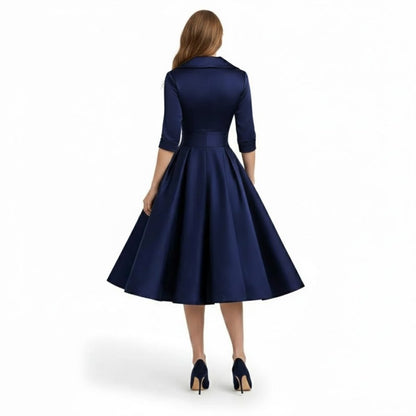 Close-up of the broad lapels and wrap bodice details on the sophisticated Seraphina wrap midi dress.