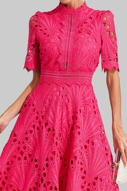 Lifestyle shot of someone enjoying an outdoor event in the stylish lace midi dress.