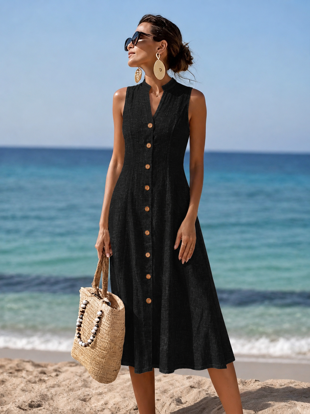 Front view of a woman wearing the vibrant blue flowy maxi dress, showcasing its elegant drape and V-neckline.
