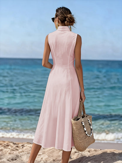 Back view of the woman in the pink flowy maxi dress, demonstrating the flattering silhouette and overall length.
