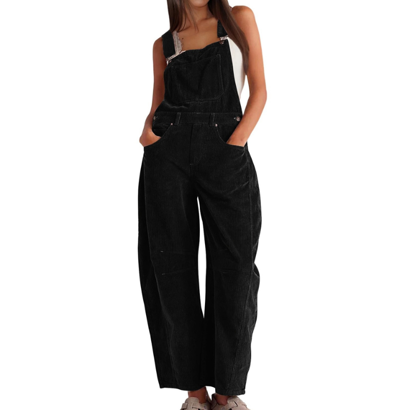 Side profile of a woman in olive green Soraya relaxed fit overalls, highlighting the adjustable straps.