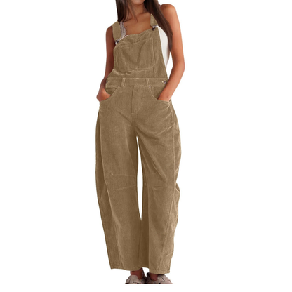 Back view of a model in brown Soraya relaxed fit overalls, demonstrating the flowing silhouette.