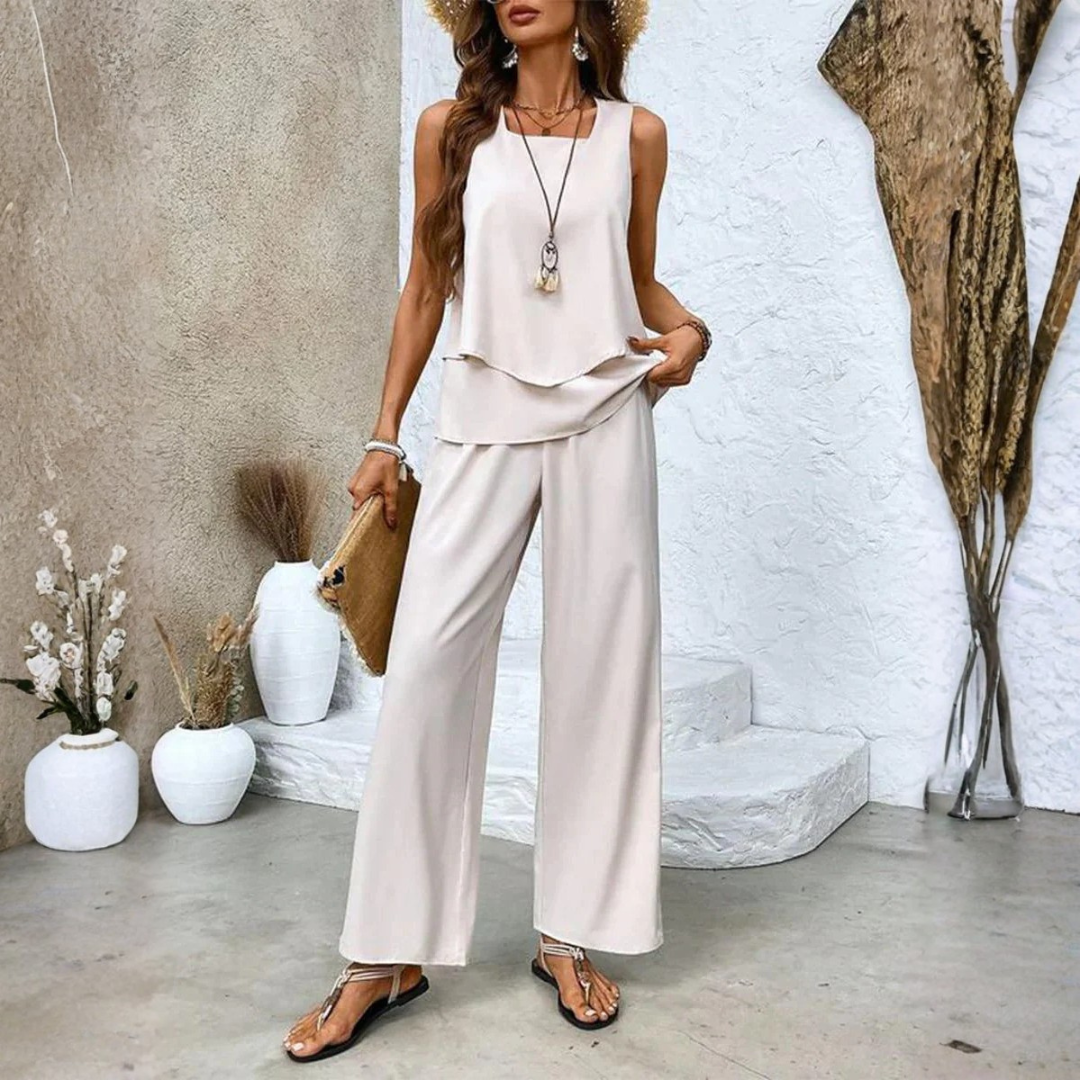 A woman smiling while wearing the brown elegant summer set, styled for a relaxed outdoor setting.
