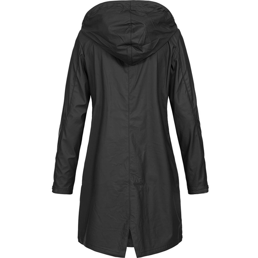 Side profile of a woman wearing a yellow chic waterproof jacket, highlighting the adjustable hood and sleeve length.