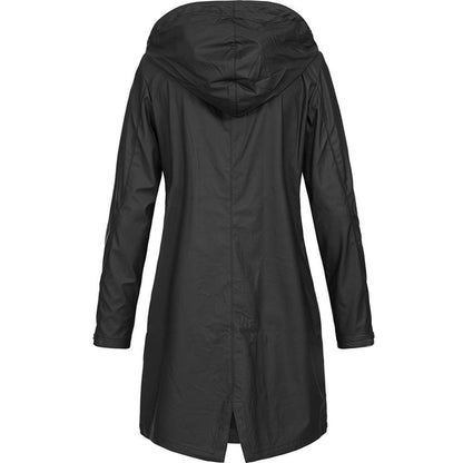 Side profile of a woman wearing a yellow chic waterproof jacket, highlighting the adjustable hood and sleeve length.
