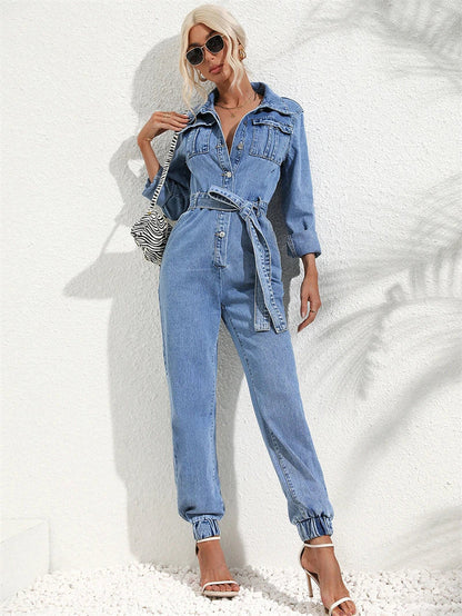Side profile of a woman showing the relaxed fit and elegant drape of the denim jumpsuit.