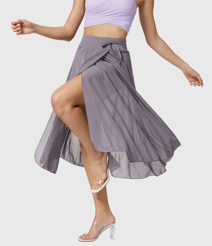 Model sitting comfortably in the violet transformable fluid skirt, showcasing its practicality and chic design.