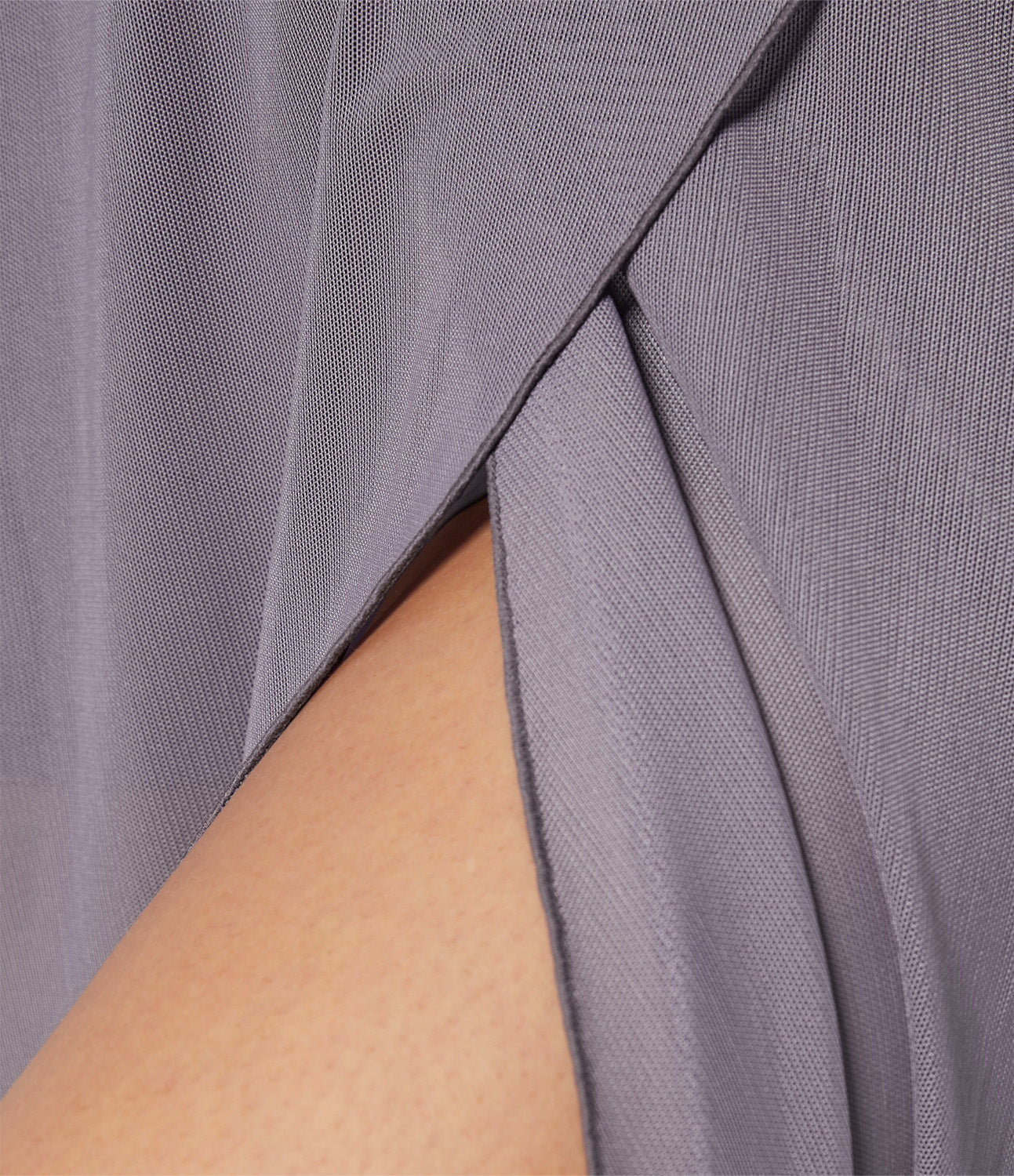 A dynamic shot of the black transformable fluid skirt in motion, emphasizing its fluid and graceful silhouette.