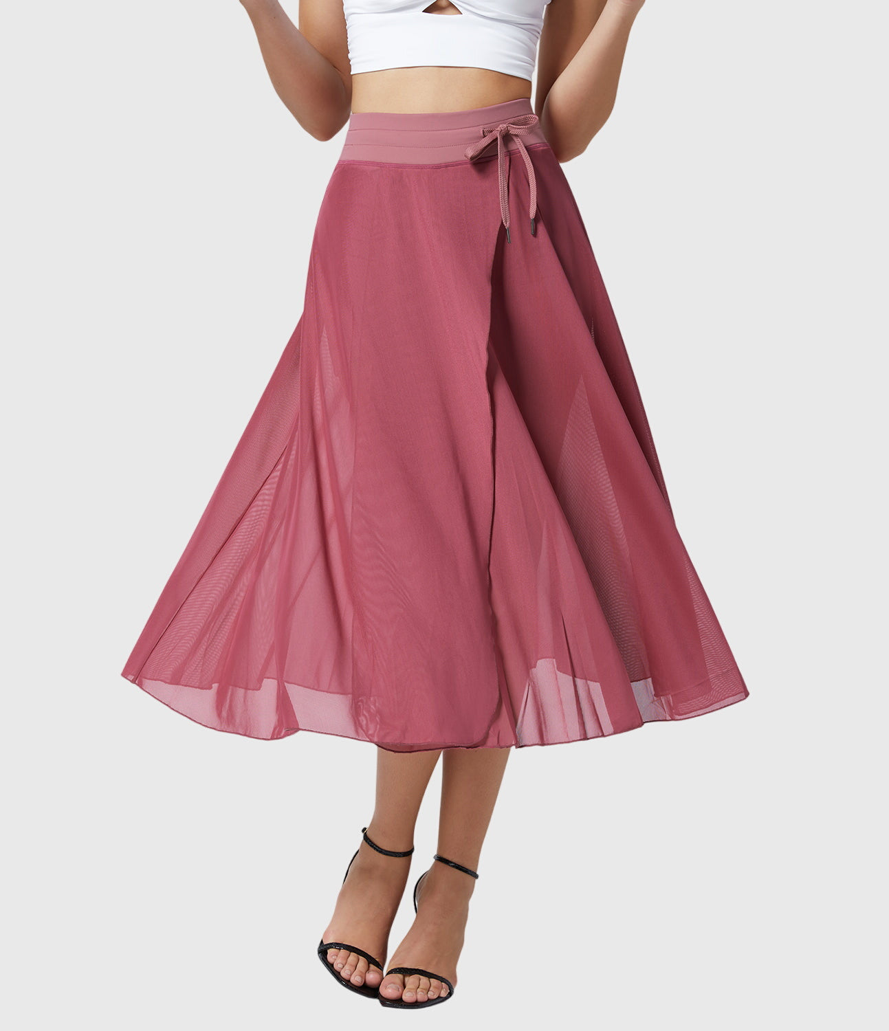 Full-length view of the blue transformable fluid skirt, demonstrating its midi length and how it pairs with sandals.