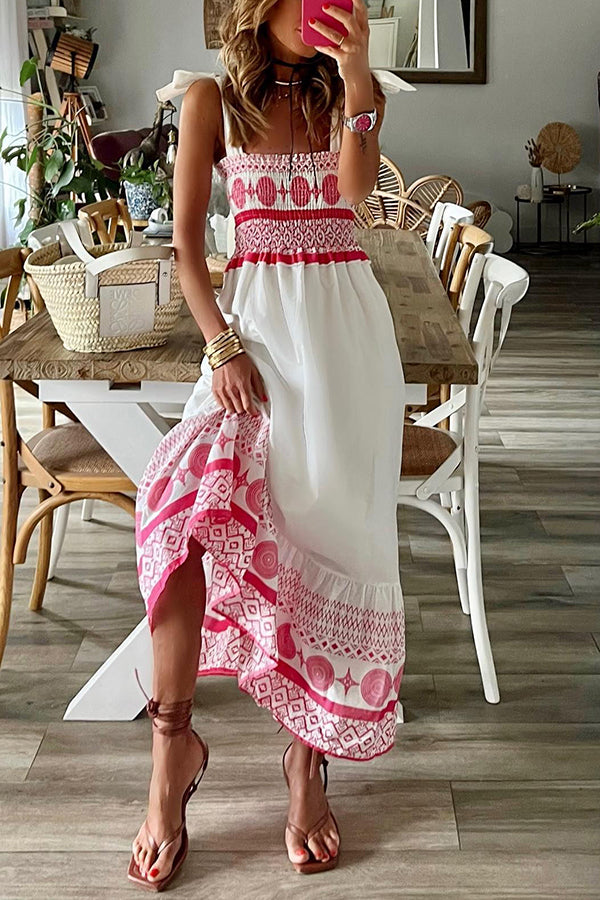 Close-up detail of the tie-shoulder straps and smocked bust on the pink Talia boho maxi dress.