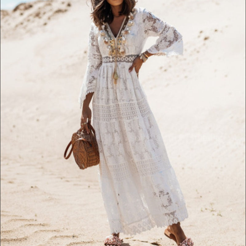 Side profile of a model wearing the Seraphina elegant flowy dress in white, demonstrating its flowy silhouette.