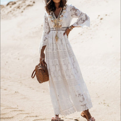 Side profile of a model wearing the Seraphina elegant flowy dress in white, demonstrating its flowy silhouette.