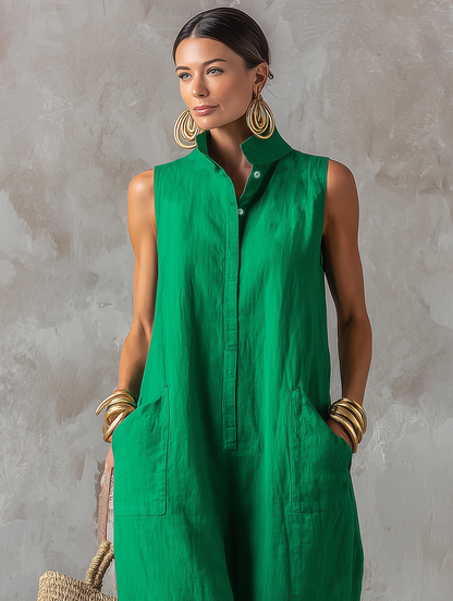 Side profile of a woman casually walking in the flowing, comfortable Aurelie jumpsuit with hands in pockets.