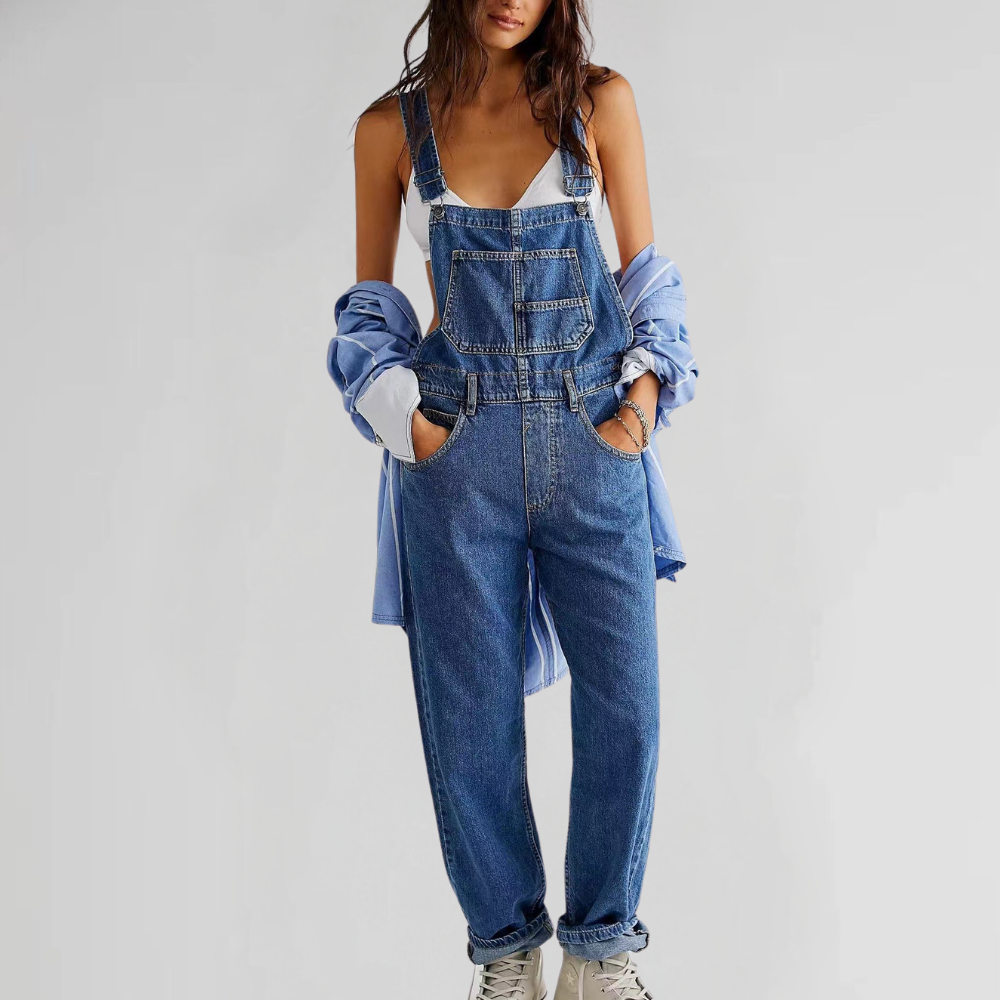Close-up of the adjustable straps and secure buckles on the stylish denim dungarees.