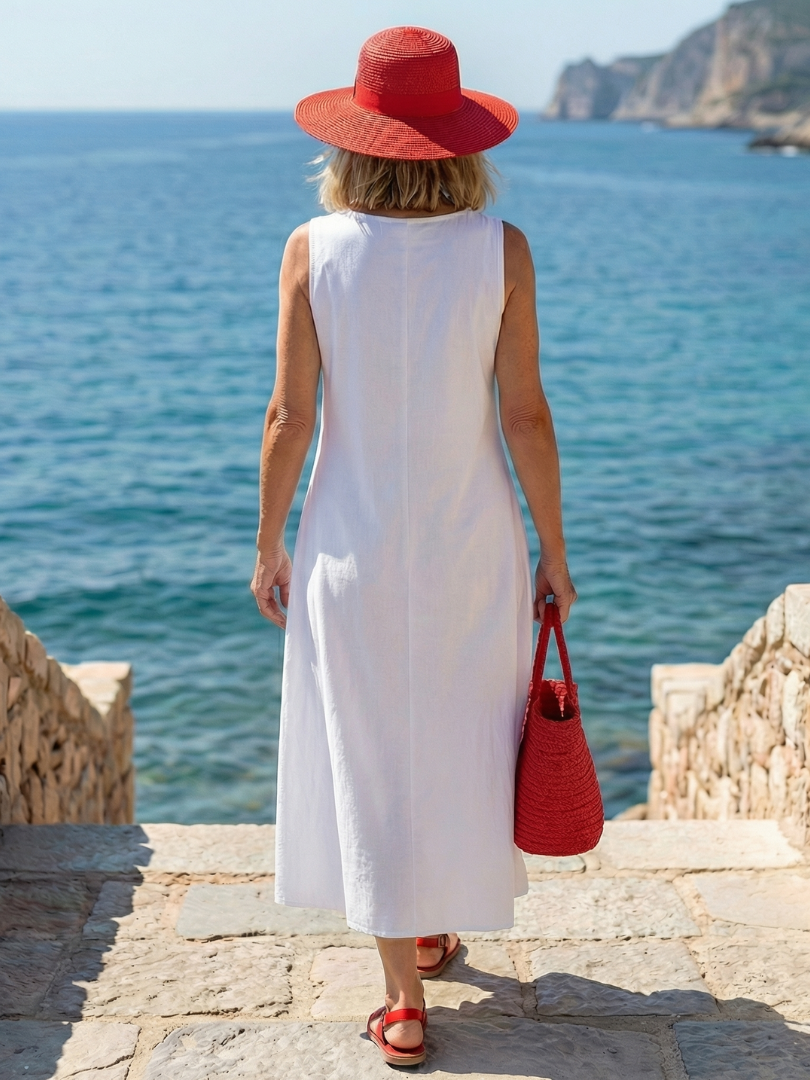 Lifestyle shot of a woman enjoying a warm day in the Kallie artistic print maxi dress, emphasizing comfort and summer style.