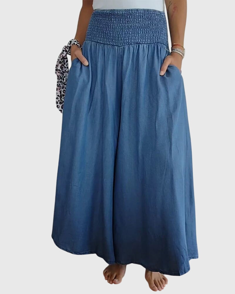 Front view of a woman wearing the blue Seraphina maxi skirt, showcasing its flowy fabric and comfortable fit.