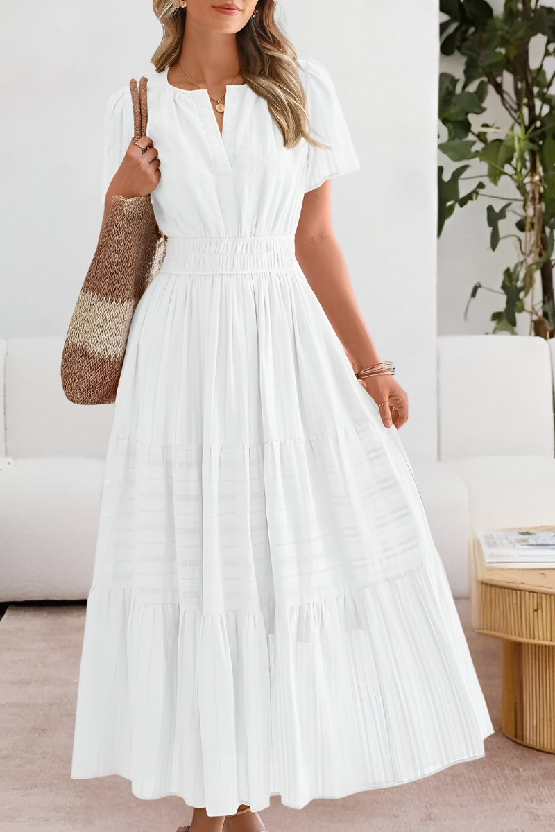 Close-up of the delicate bohemian details on the neckline of the Yara flowy dress.