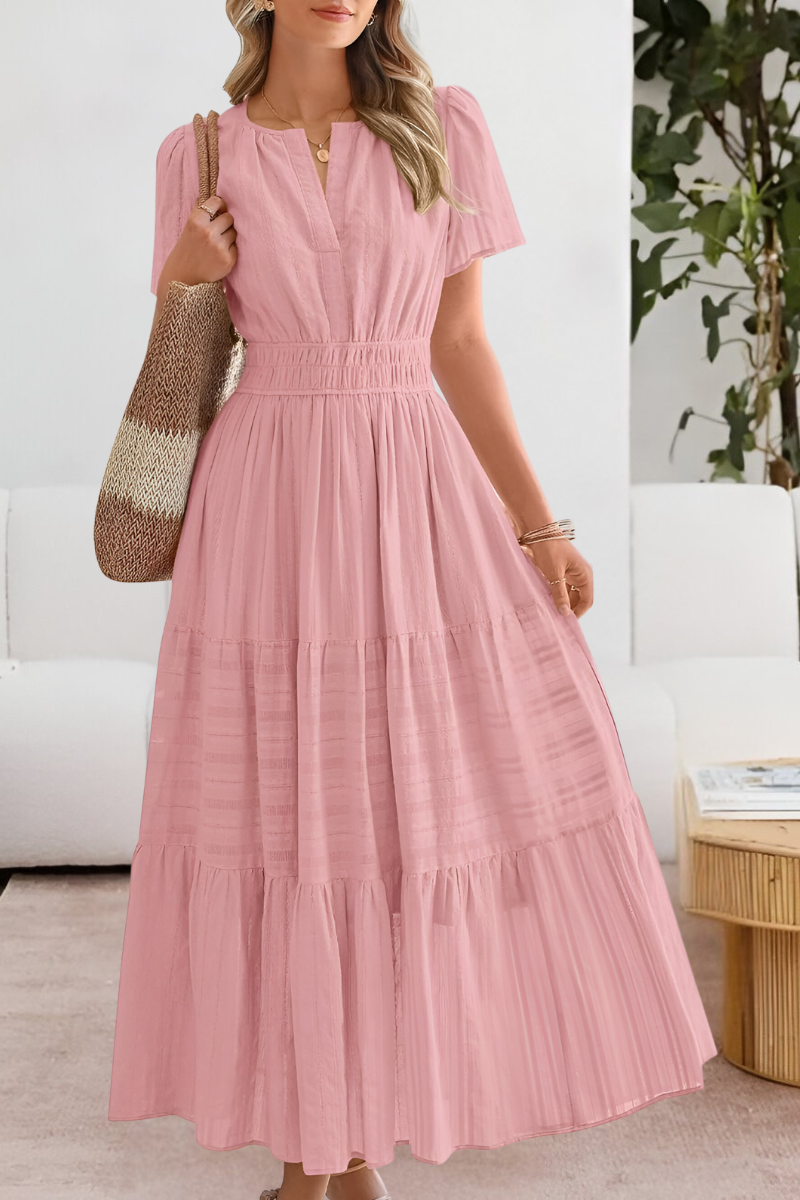 Yara flowy boho summer dress in a cheerful red, back view, with flowing silhouette.